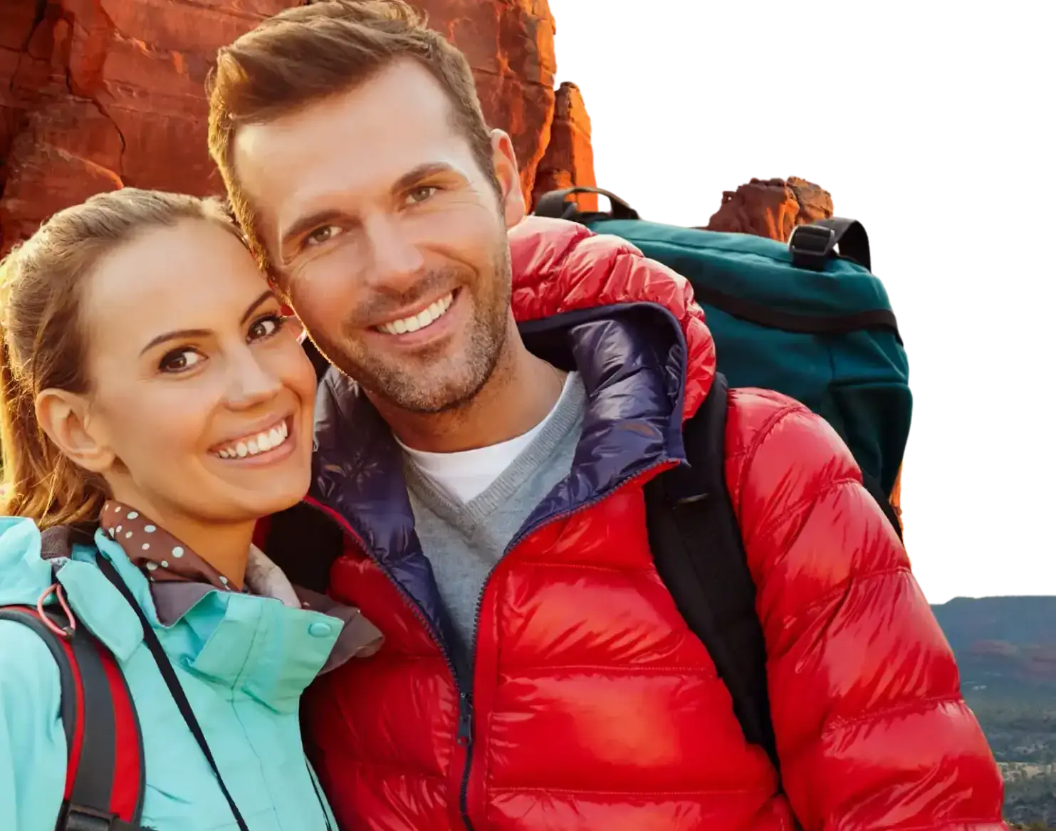 Young couple in hiking gear, prepared for the cold in the mountains around Phoenix Valley. They've worked hard to have the financial wherewithal to be able to take these trips